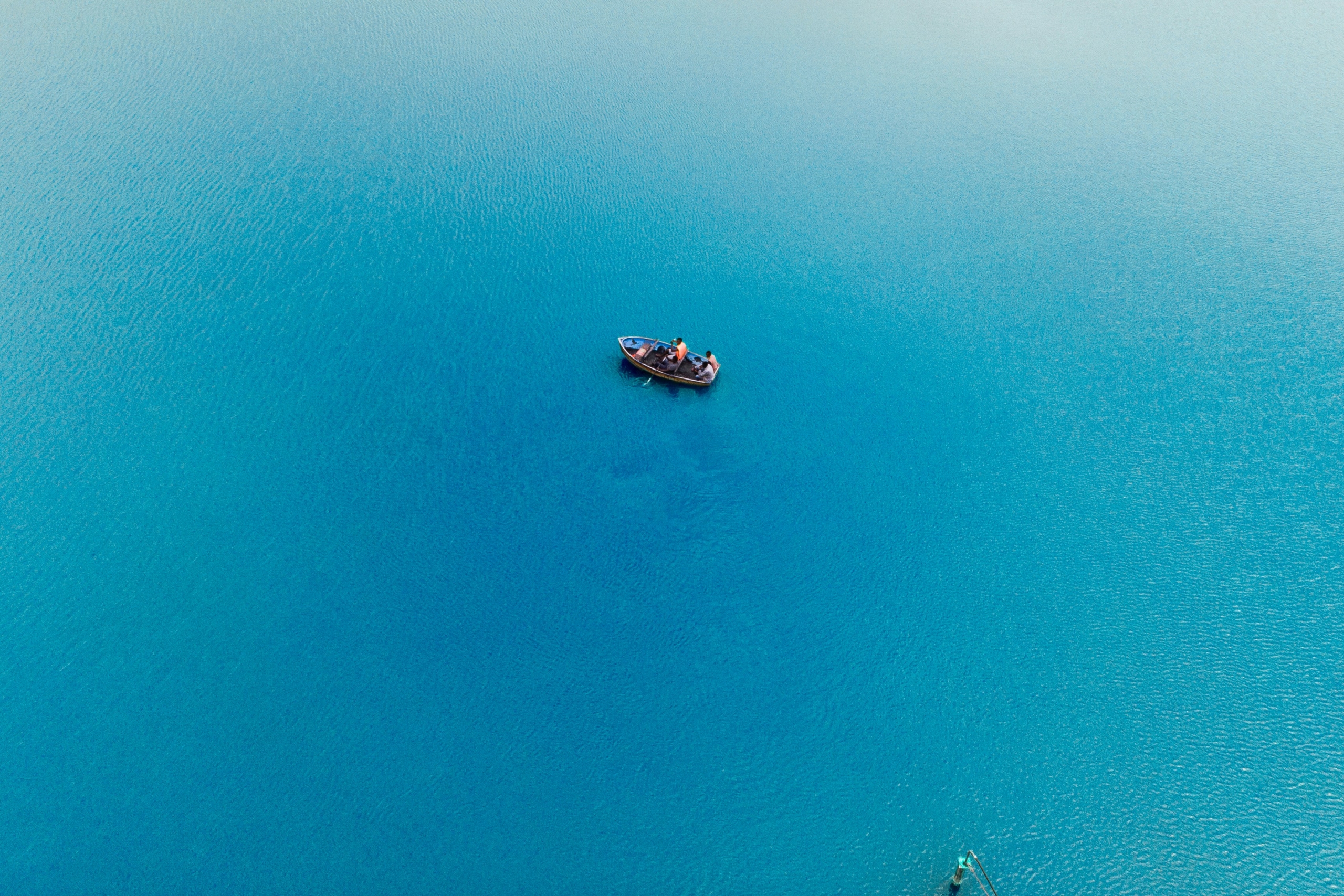 Local girl on a Zanzibar beach with a traditional dhow sailboat